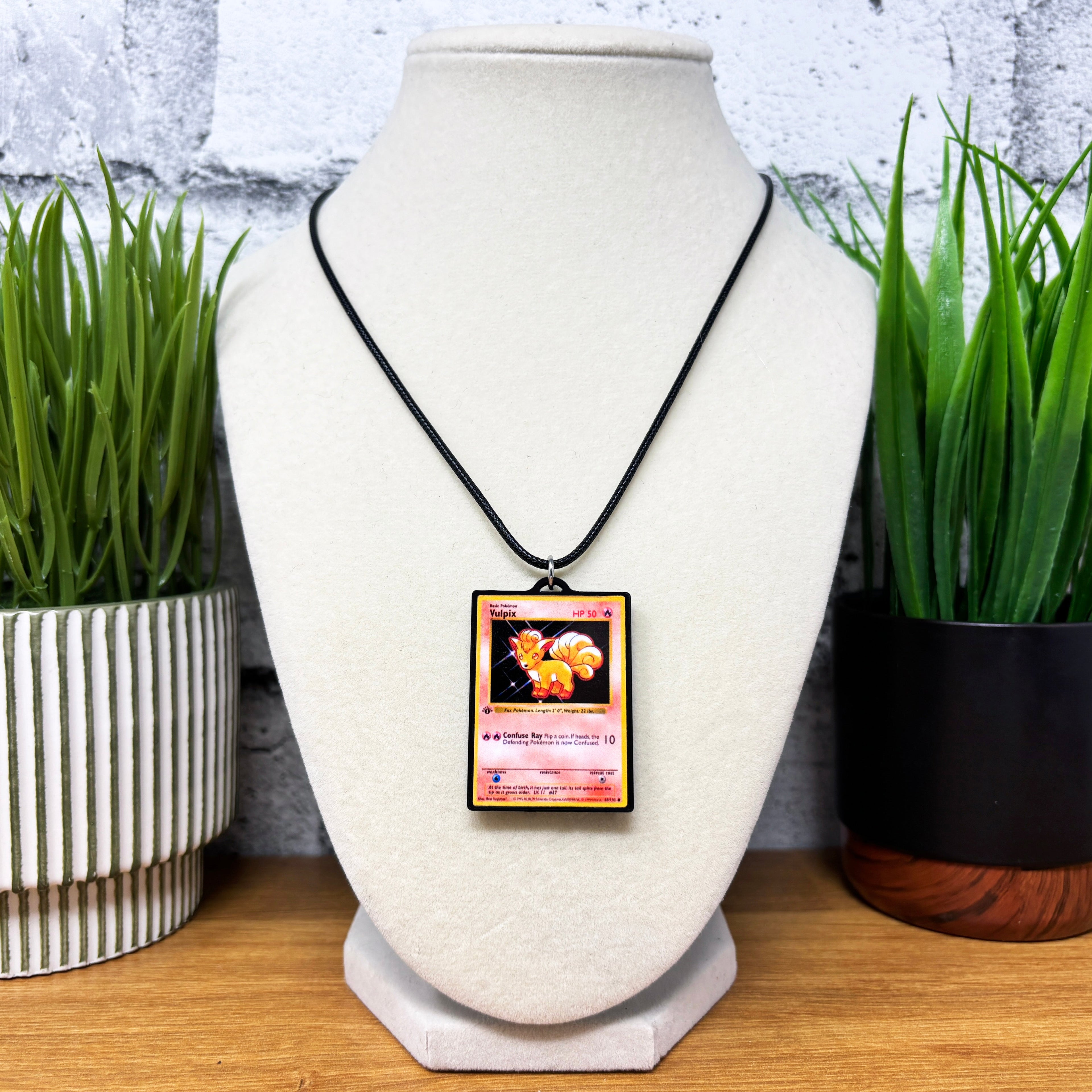 pokemon card necklace Pokemon Card Necklaces (1-50) 6. Charizard
